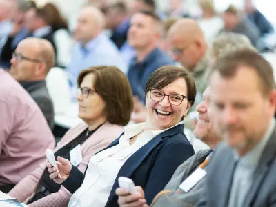 Professionals seated at a continuing education seminar