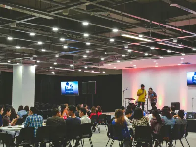 An audience seated for a talk at an event venue