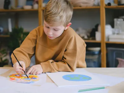 A pupil working at a classroom desk