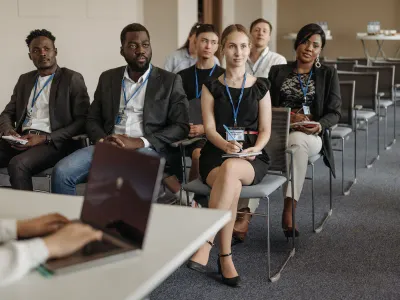 Staff seated in rows at a workplace training session