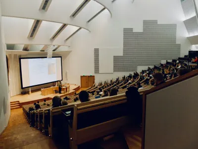 Students in a tiered university lecture hall